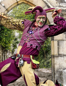 jovial male cosplaying as a jester in modern setting