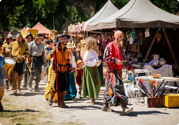 modern day medieval fair, people wearing different costumes