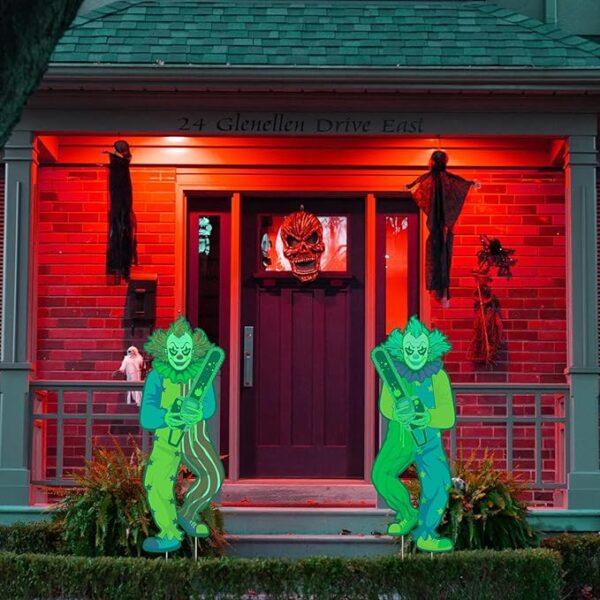 halloween yard clown signs at night