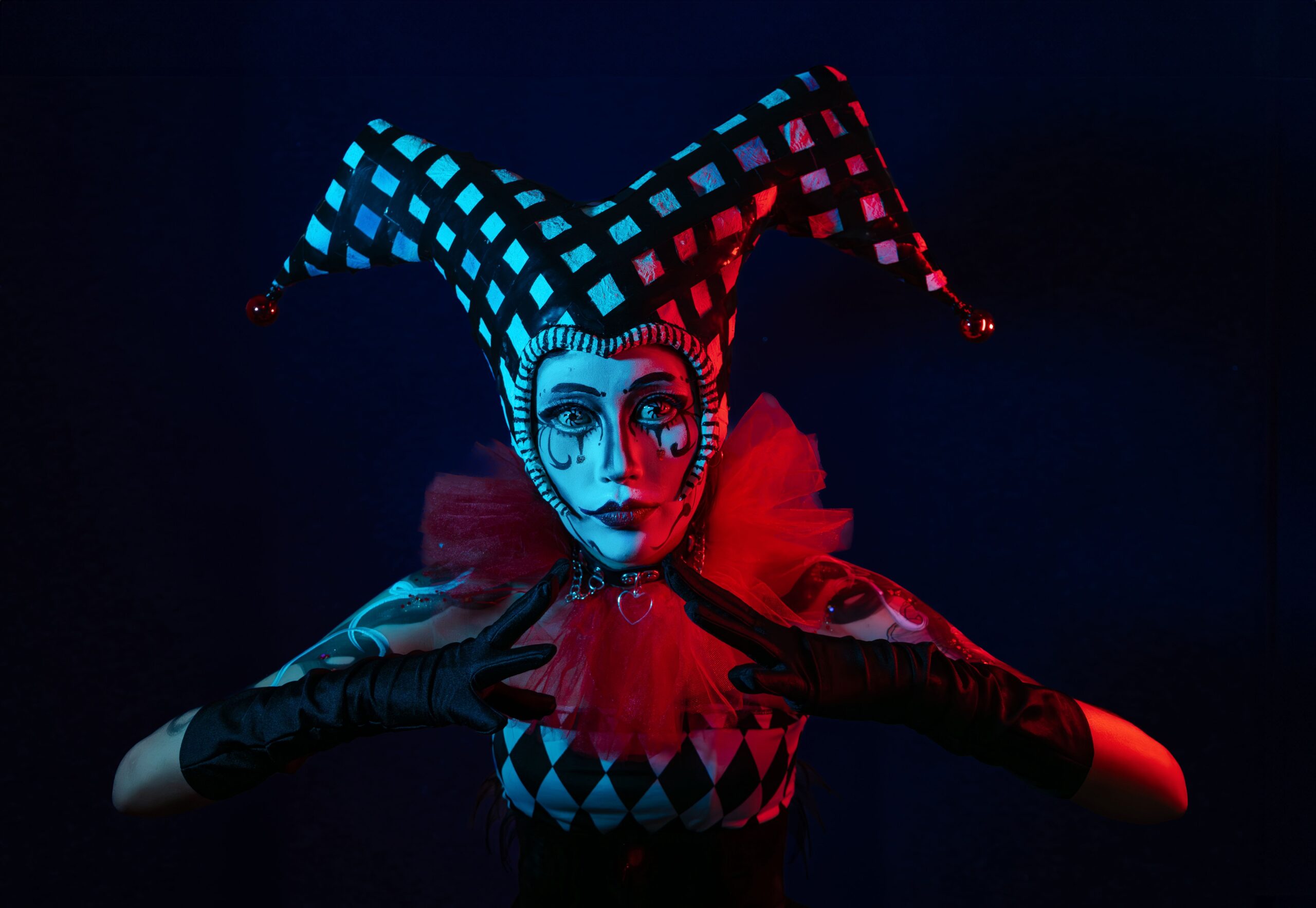 Clown in vibrant costume posing outdoors